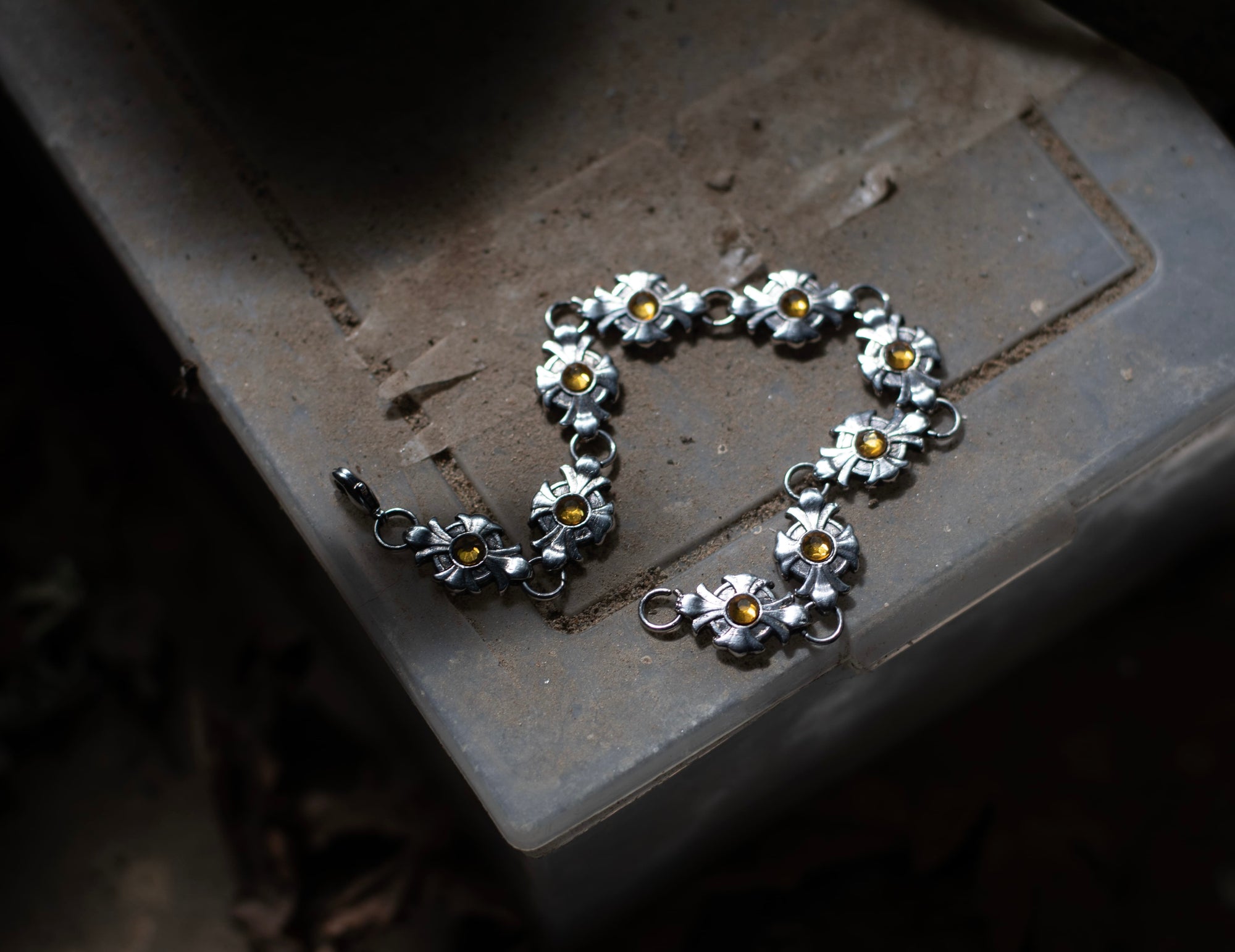 Cross bracelet with yellow stones