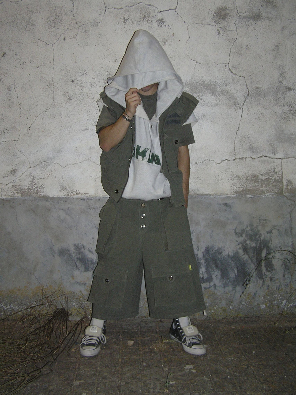 Streetwear outfit with olive cargo vest, white hoodie and oversized cargo shorts, Days Of War